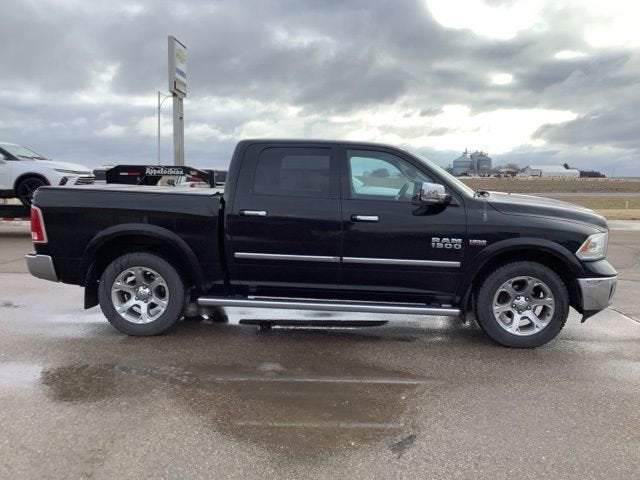 2014 RAM 1500 Laramie in Black — front three-quarter view