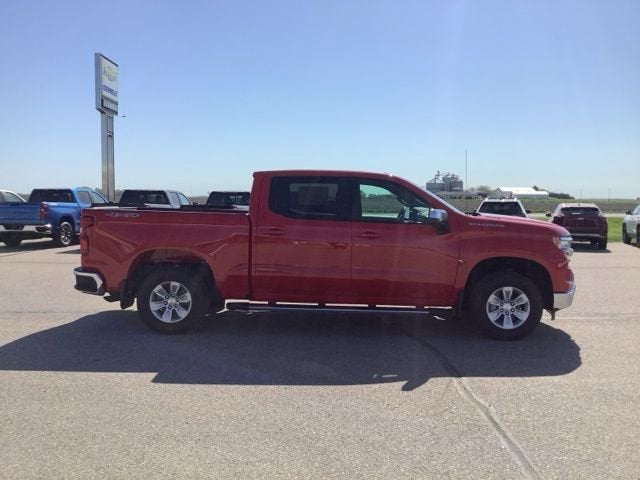 2025 Chevrolet Silverado 1500 LT in Red Hot — front three-quarter view