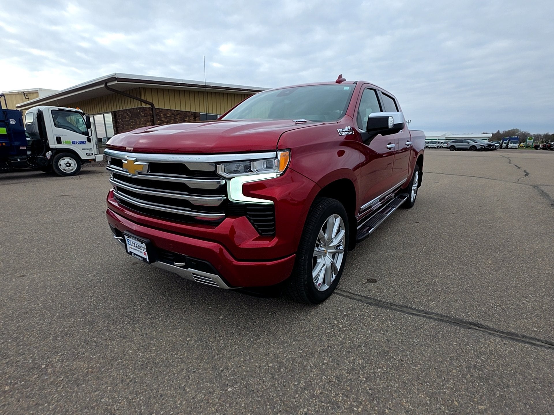 2024 Chevrolet Silverado 1500 High Country in Radiant Red Tintcoat — front three-quarter view